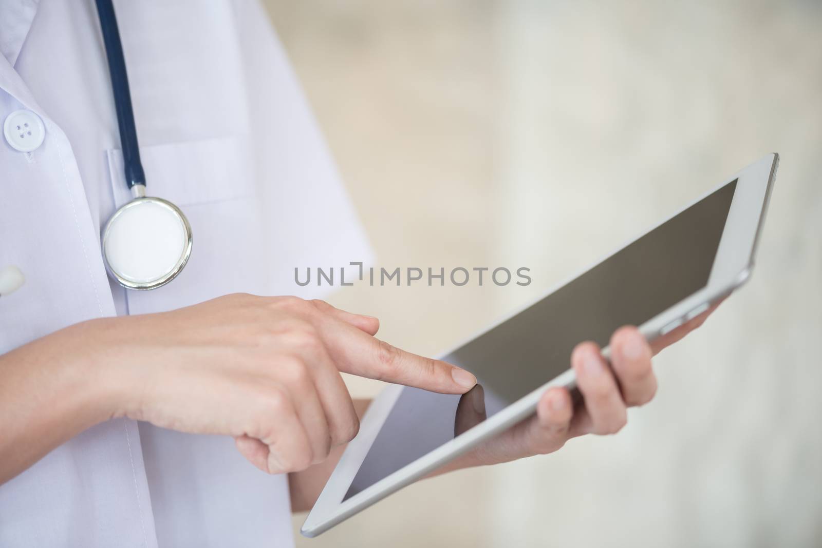 woman doctor using tablet