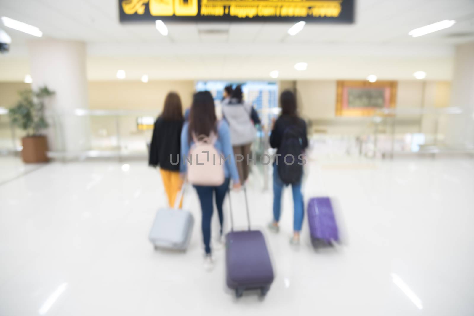 abstract blurred people with baggage  walking for travel