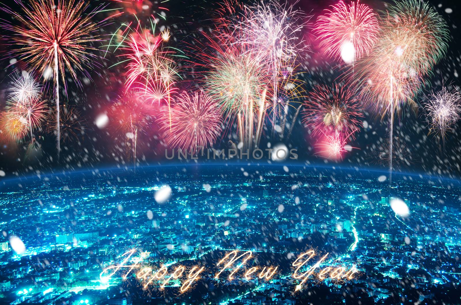 fireworks over blue night city and text HAPPY NEW YEAR for happy new year celebration