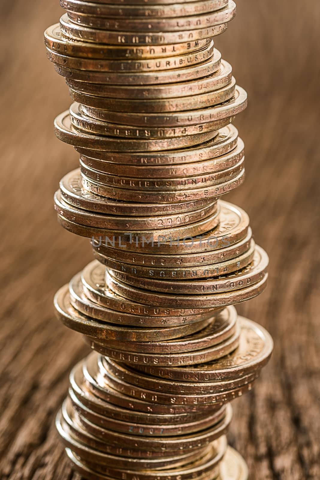 stack of dollars money coin on grunge wooden background