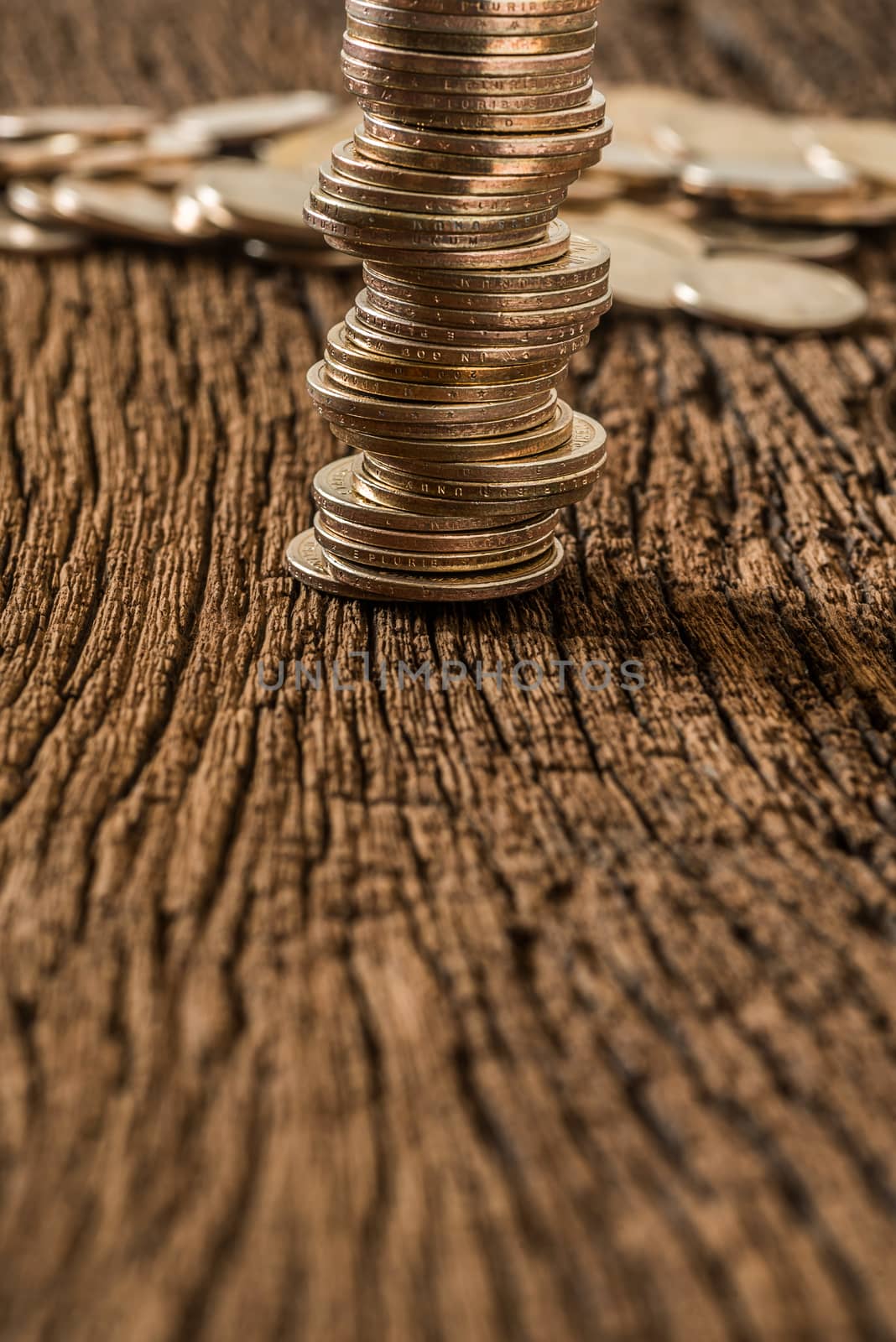 stack of dollars money coin on grunge wooden background