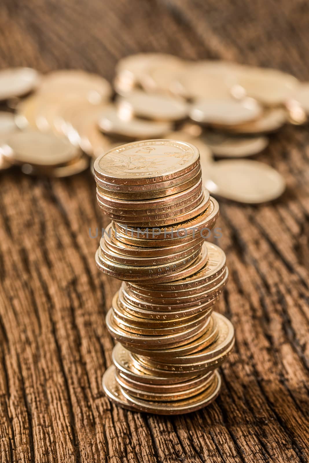 stack of dollars money coin on grunge wooden background