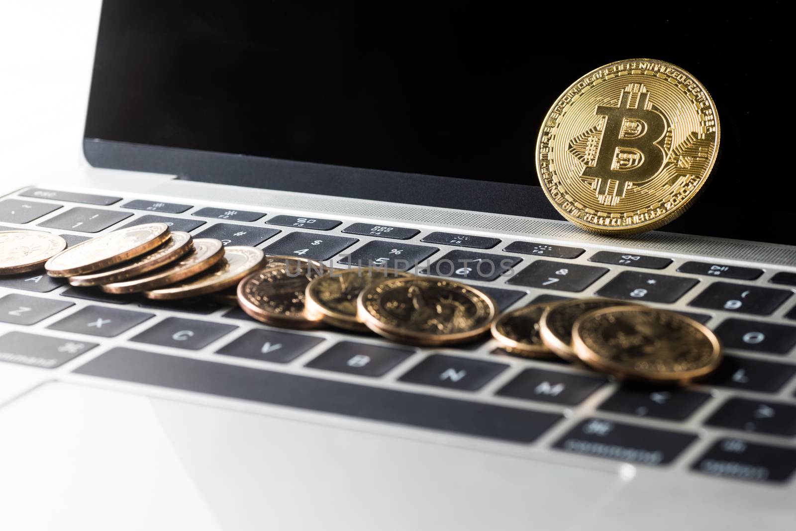 Cryptocurrency golden bitcoin and dollars money on laptop computer, digital currency concept