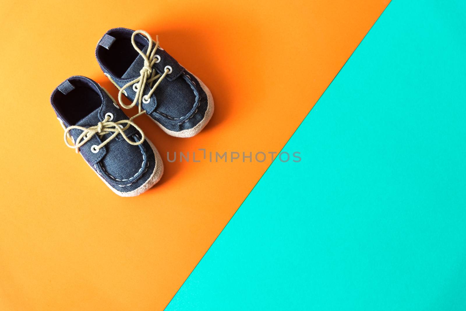 kids fashion shoes on orange green paper background