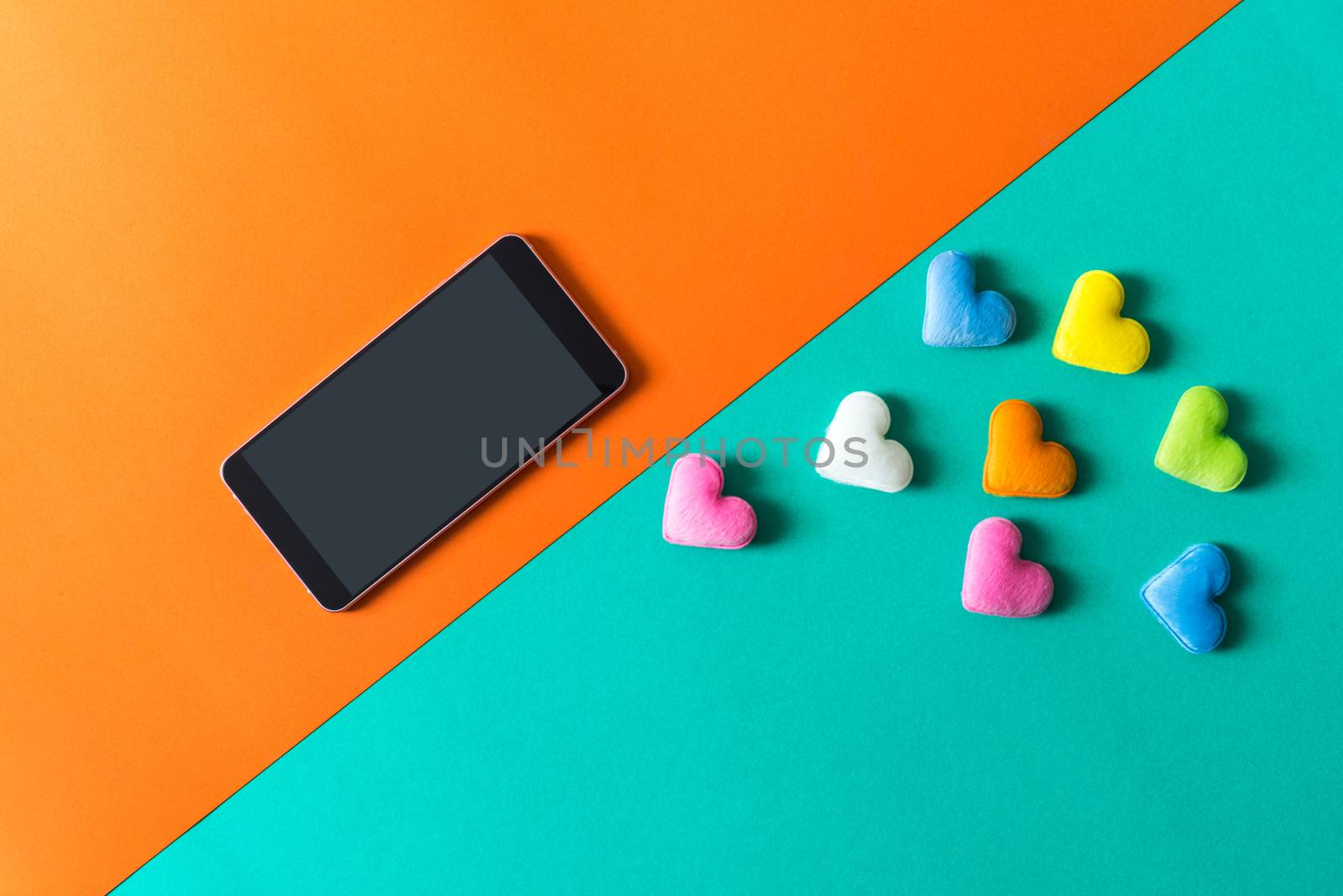 mini heart splash out from smart phone , valentine concept
