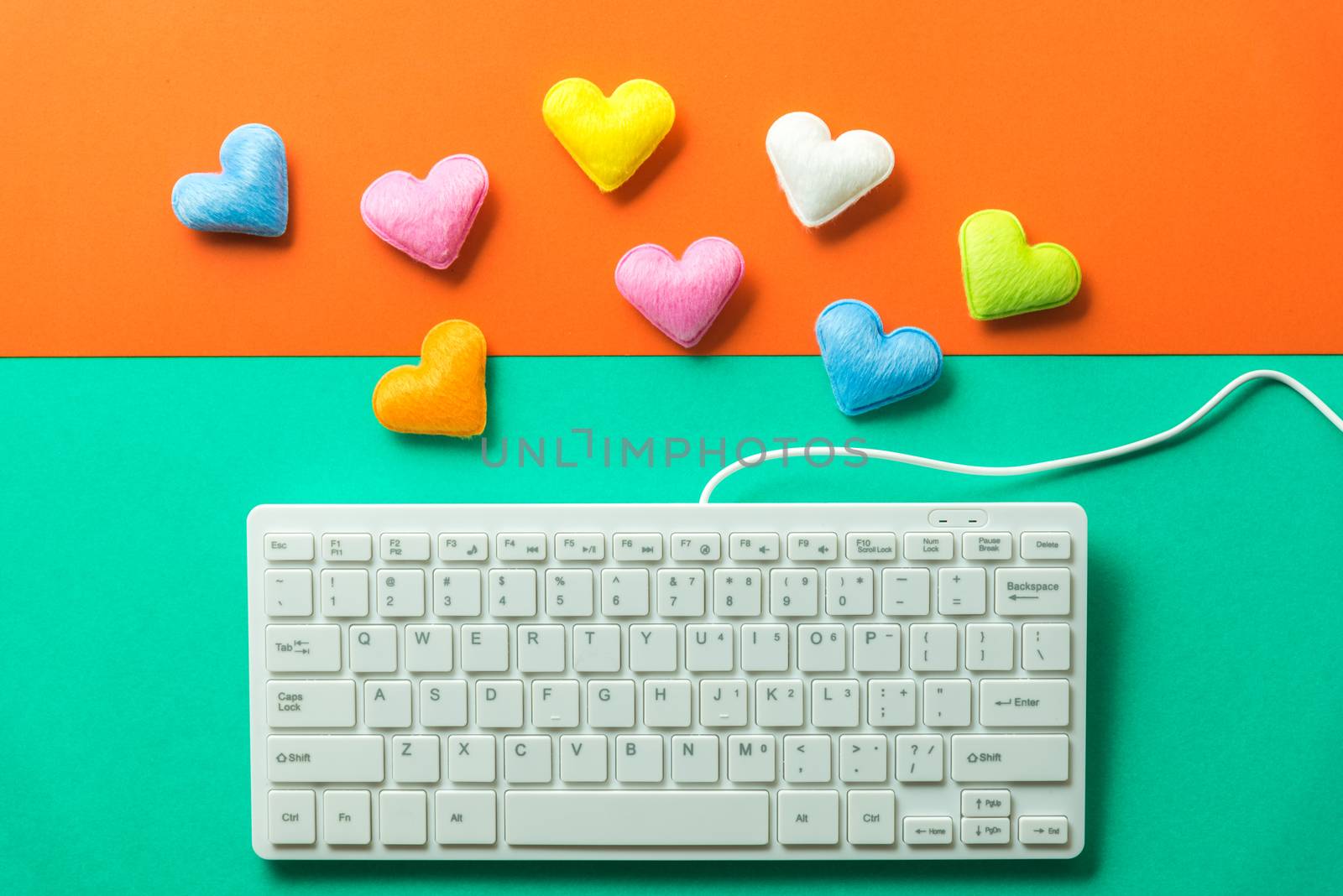 mini heart splash out from computer keyboard , valentine concept