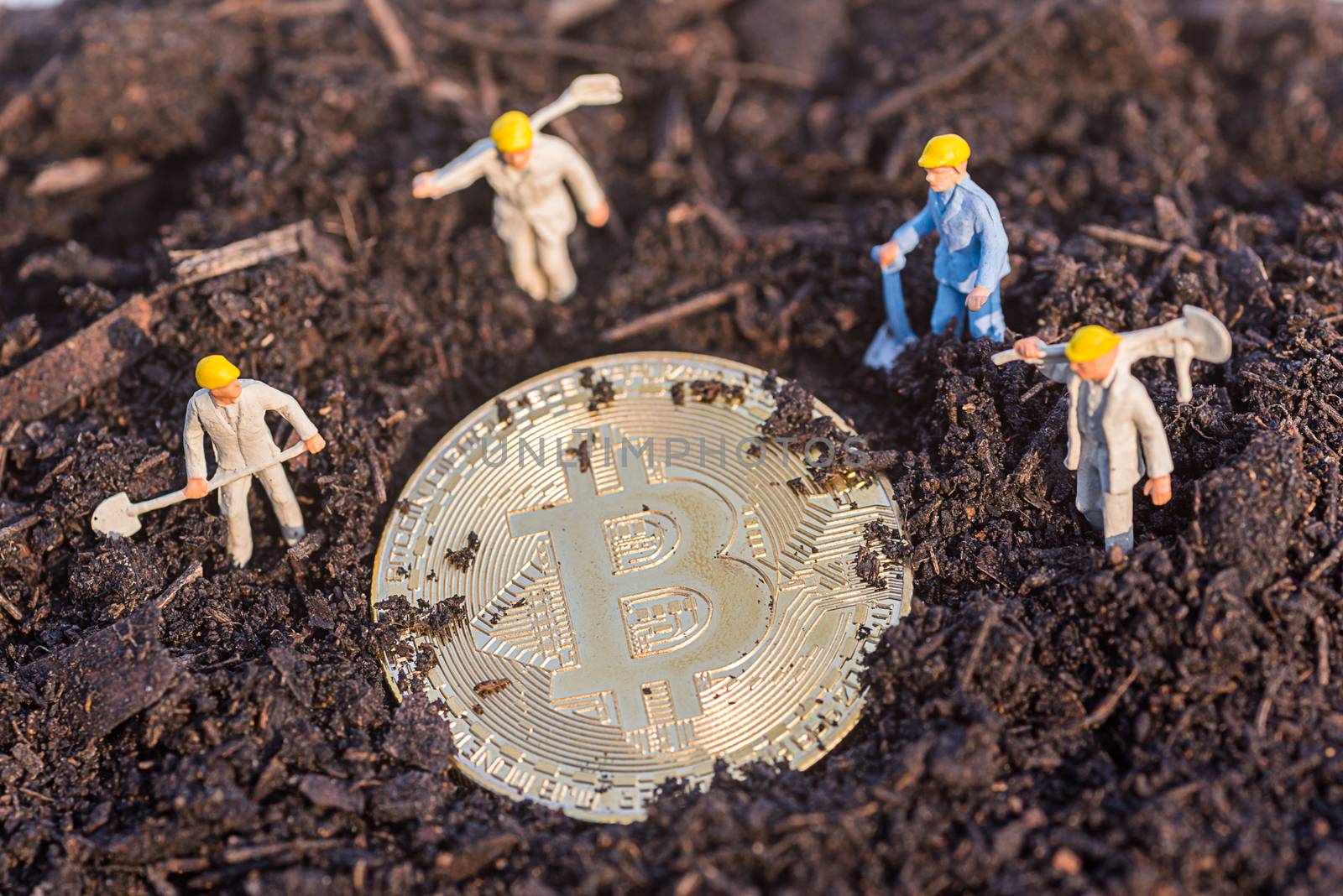 miniature worker people found gold bitcoin in soil agricultural plots field