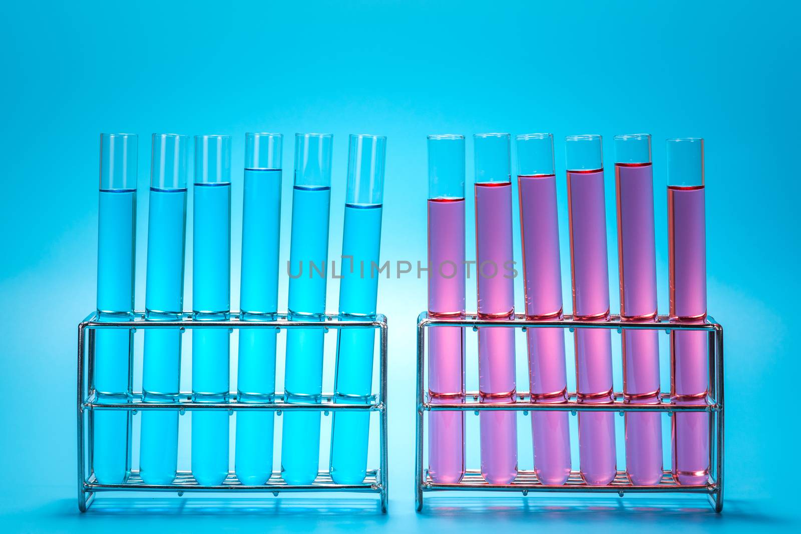 science laboratory test tubes on light blue background , laboratory equipment