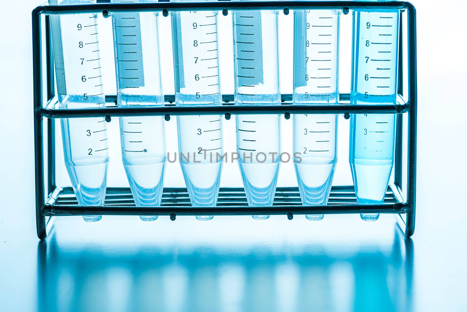 science laboratory test tubes in rack by Lerttanapunyaporn