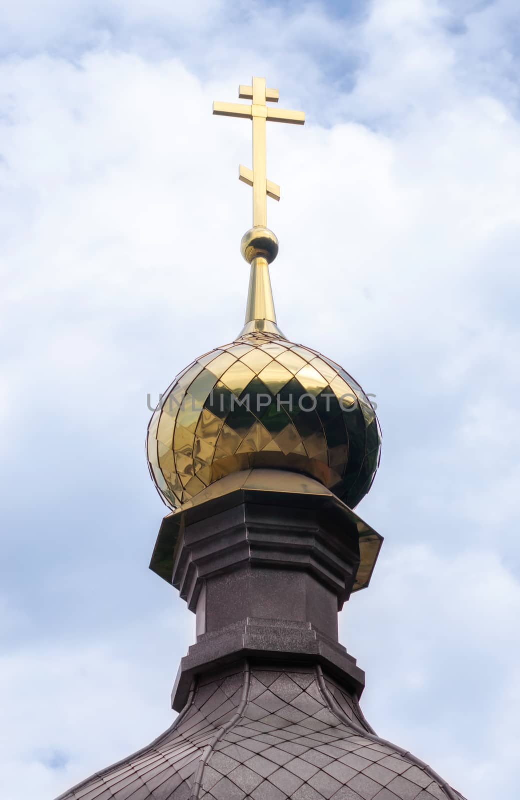 bottom view domes of christian church with crosses on blue sky background in Ukraine