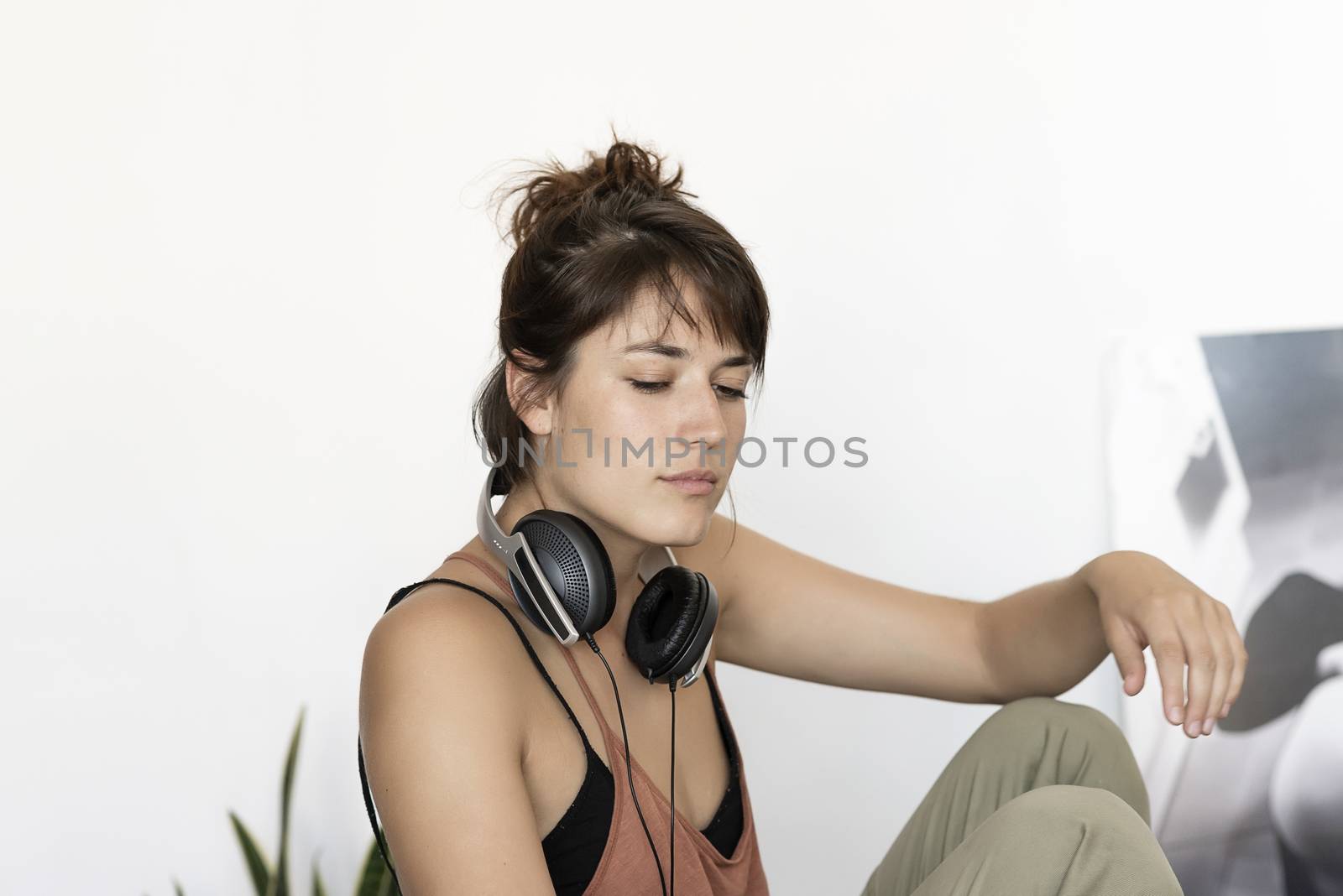 Young happy woman sitting at desk, working on computer at home by raferto1973