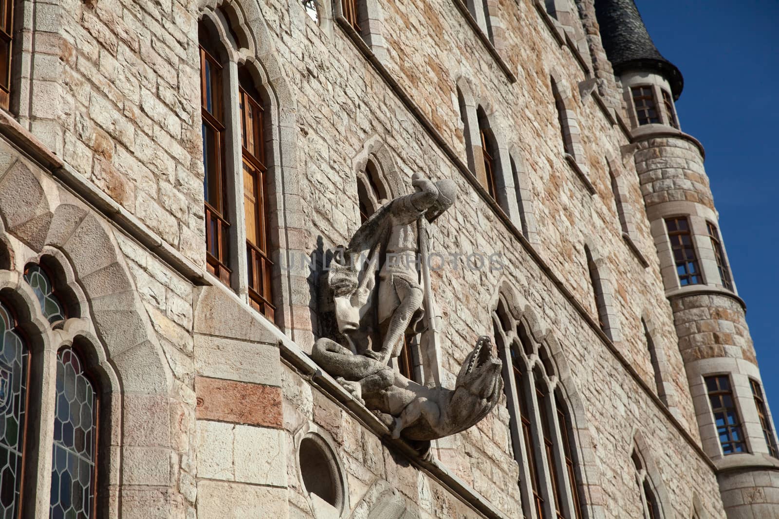 Leon, Spain - 9 December 2019: Saint George killing dragon statue above the entrance to Casa Botines