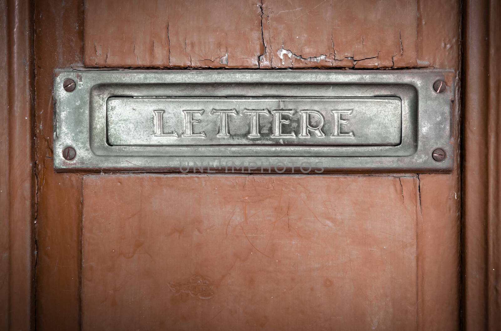 Letter box in a vintage door by germanopoli