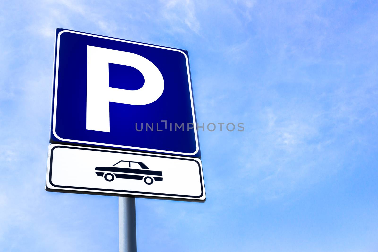 Road symbol on a background of a blue sky. Parking. Space for text.