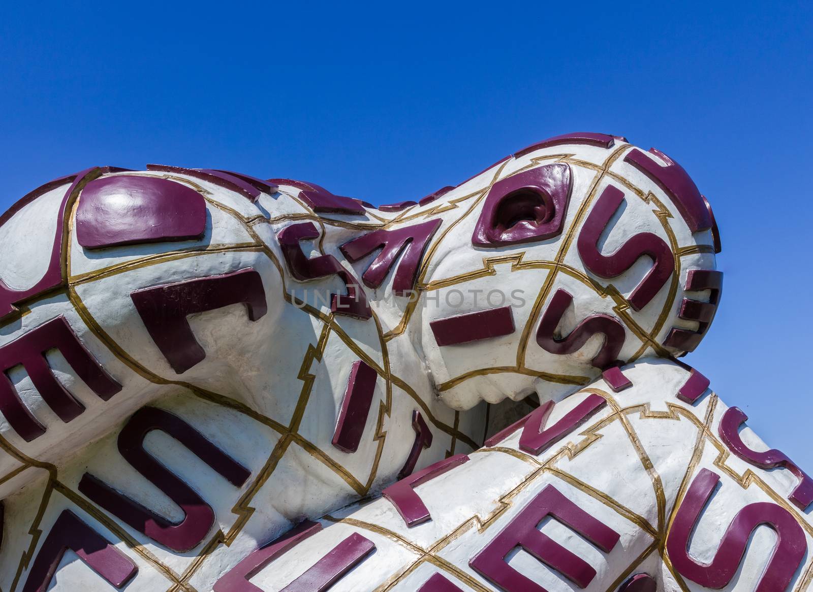 Abano Terme (PD), ITALY - April 8, 2017: the modern tired sculpture against blue sky, artwork of the artist and sculptor Rabarama who work on the representation of the body.