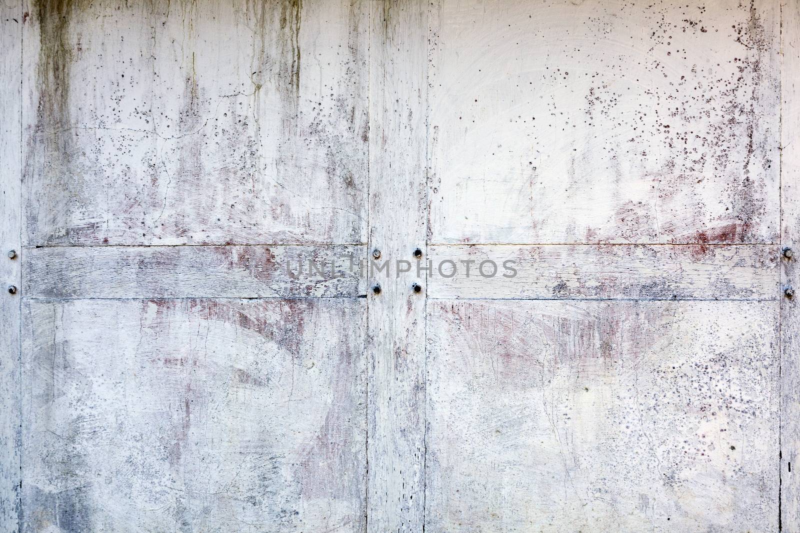 Old whitewashed weathered distressed cracked cement stone wall texture background