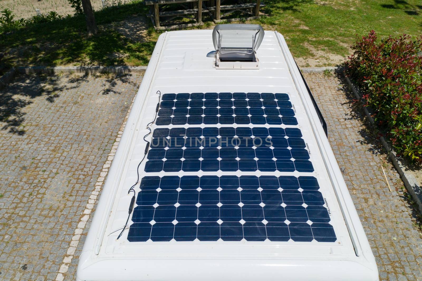 Camper van solar roof panels with skylight top view Motorhome by Luispinaphotography