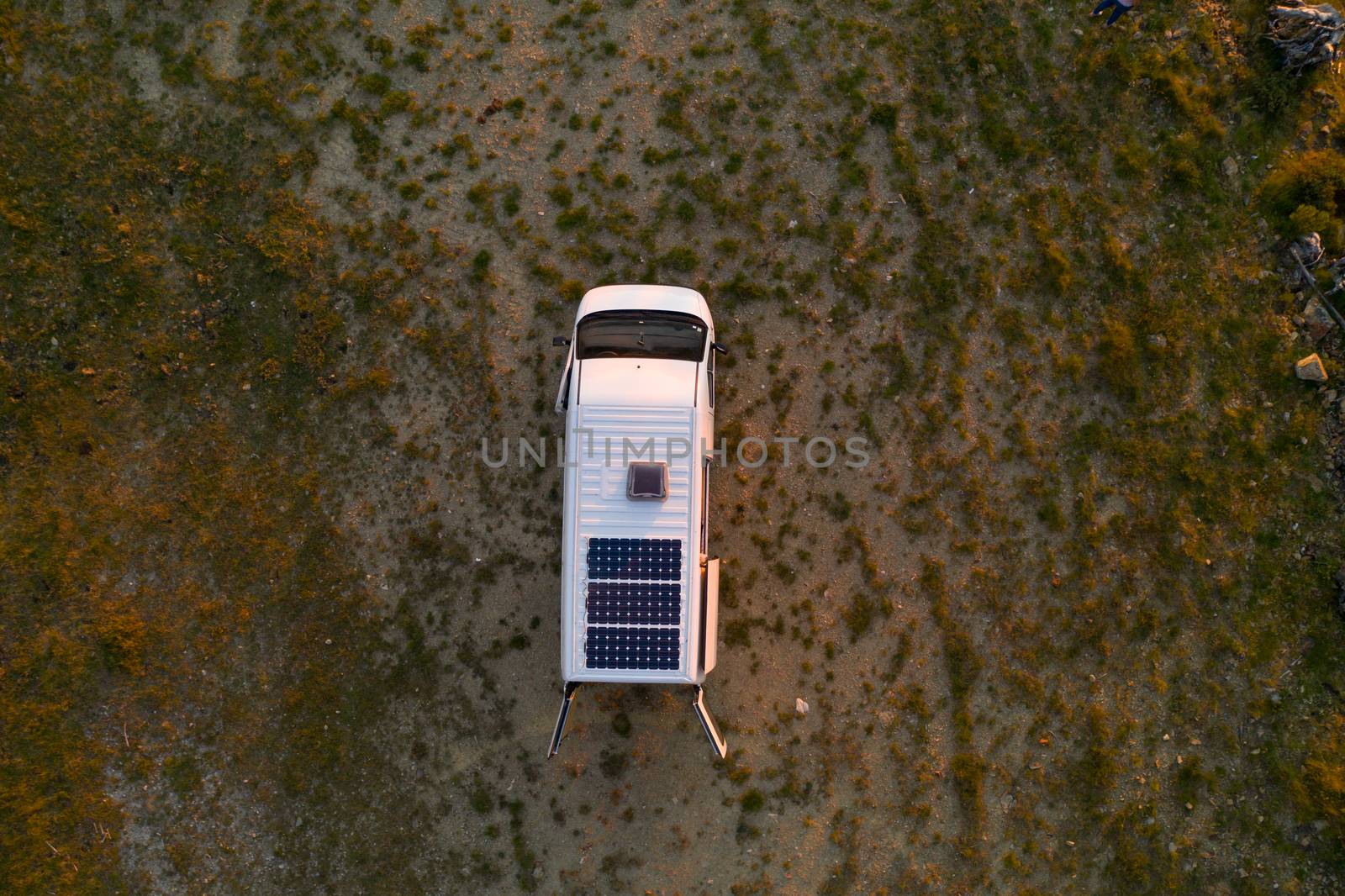 Camper van motorhome with solar panels drone aerial top above view in Arouca Geopark, in Portugal by Luispinaphotography