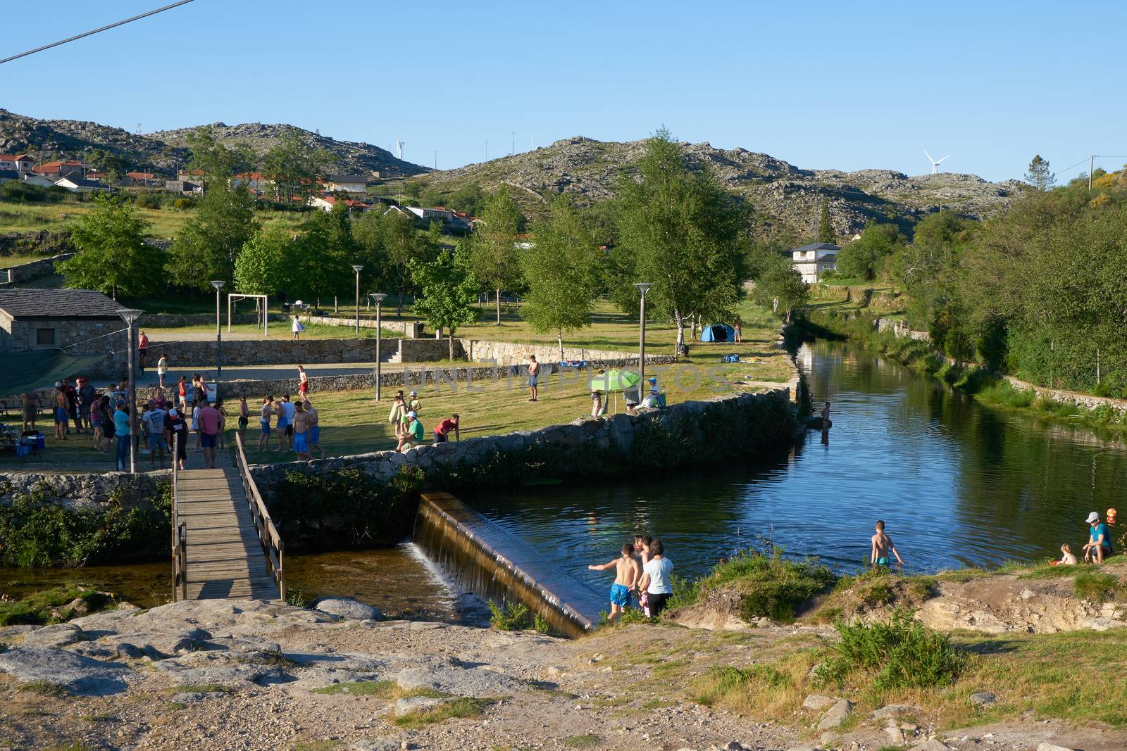 River beach in Albergaria da Serra full of tourists in Serra da Freita Arouca Geopark, in Portugal