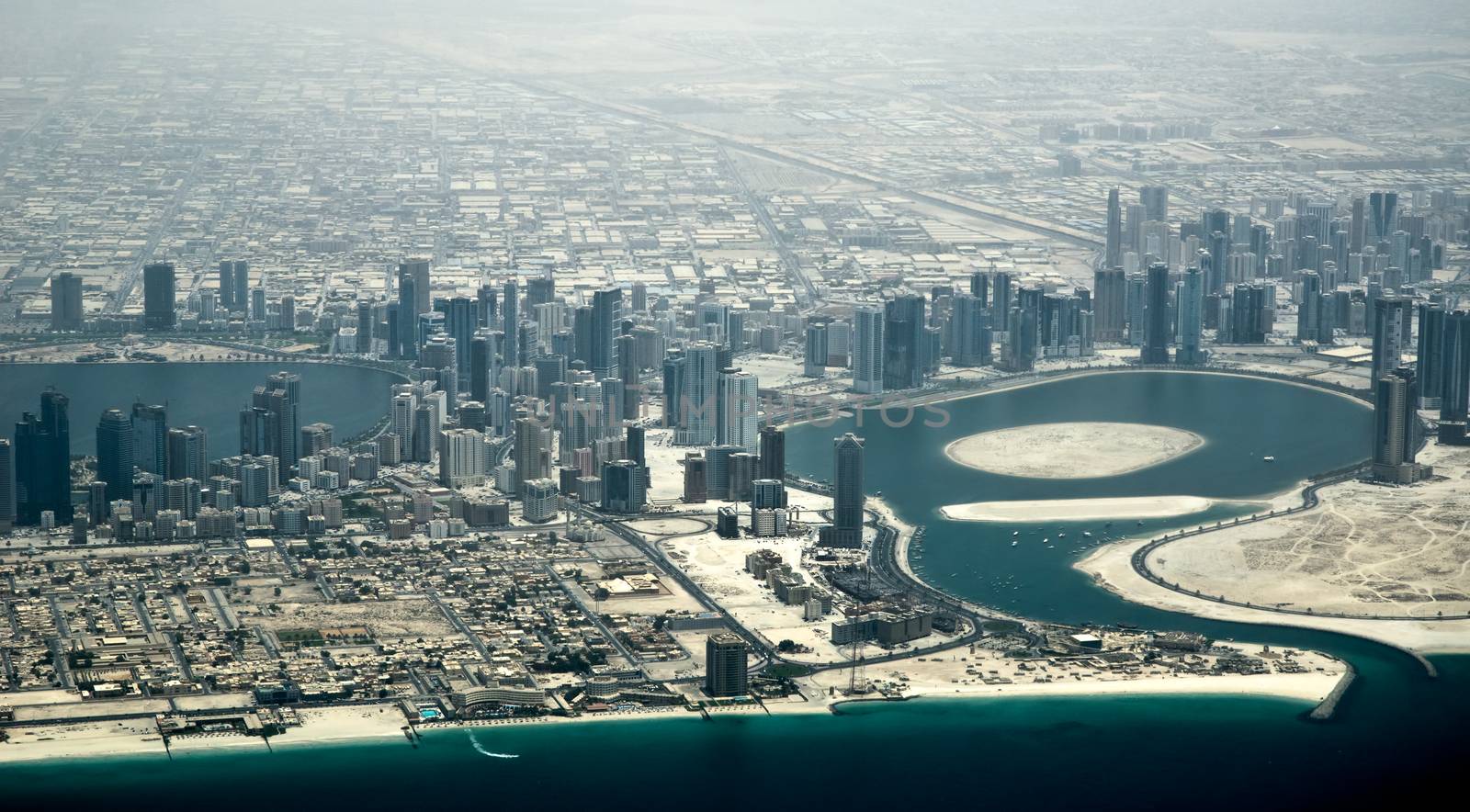 Aerial view of Dubai bay with apartments and skyscrapers (United Arab Emirates)