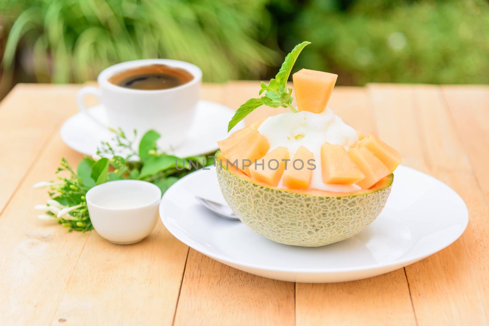 Melon Bingsu with Sweetened Condensed Milk on wood table