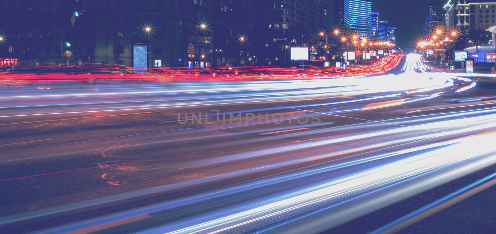 Moving car with blur light through city at night. Moscow, Russia.