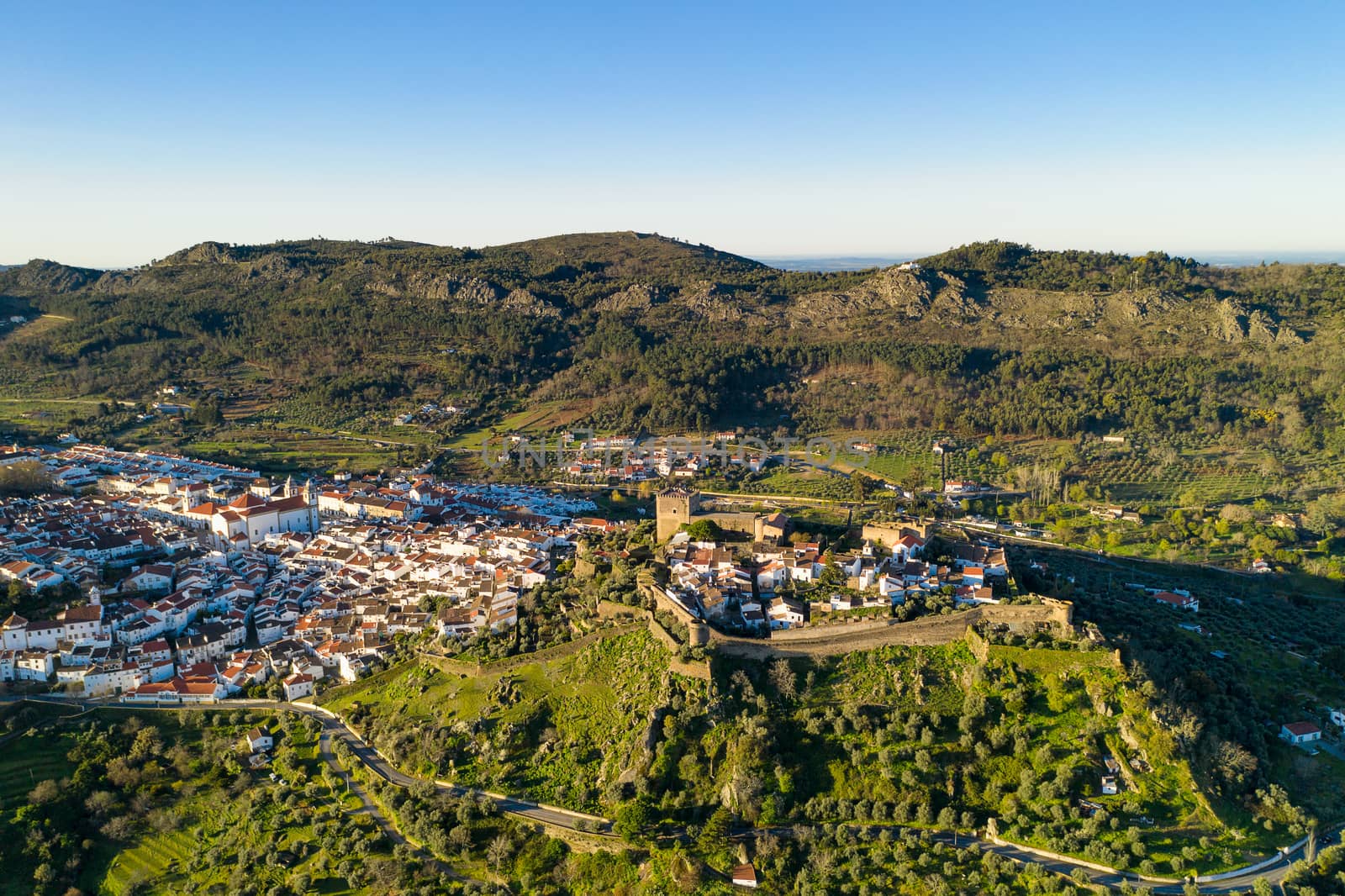 Castelo de Vide drone aerial view in Alentejo, Portugal from Serra de Sao Mamede mountains by Luispinaphotography