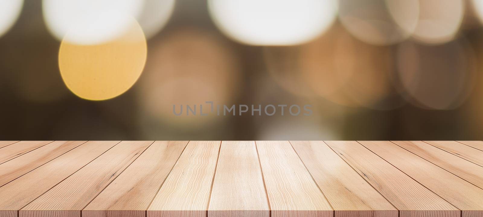 Empty wooden table top with lights bokeh on blur restaurant background