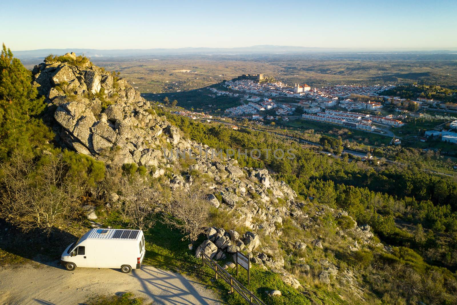 Castelo de Vide drone aerial view in Alentejo, Portugal from Serra de Sao Mamede mountains and a camper van by Luispinaphotography