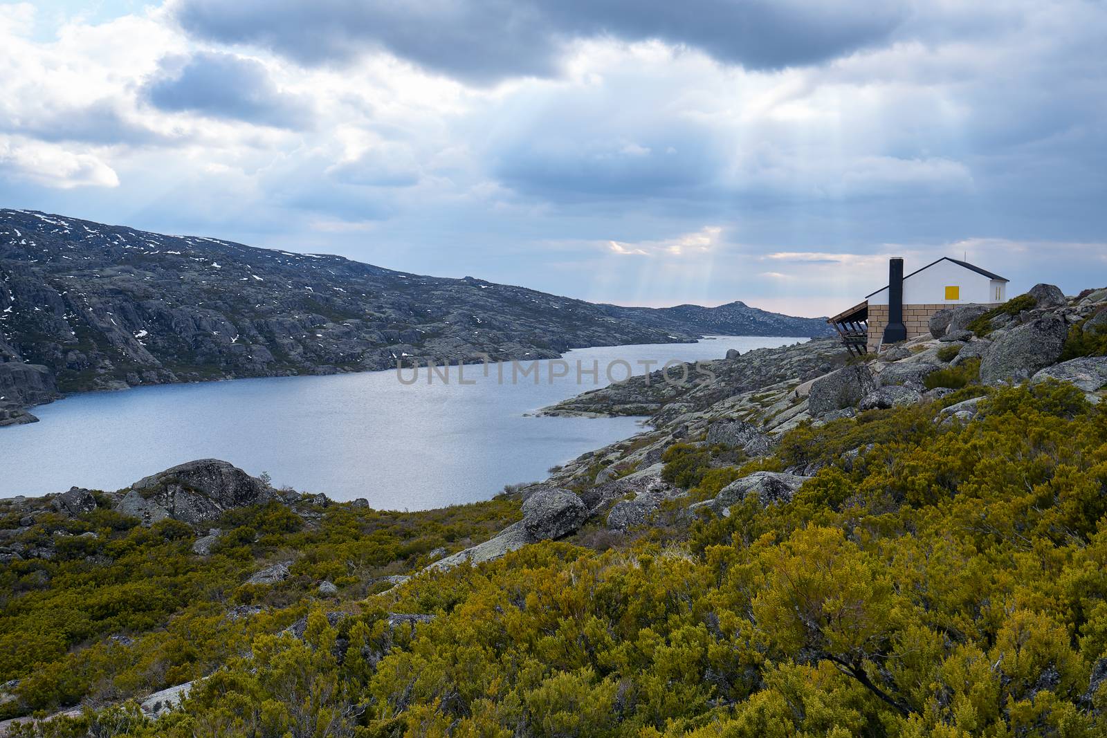 Beautiful house social distancing in lake Lagoa comprida lagoon in Serra da Estrela, Portugal by Luispinaphotography