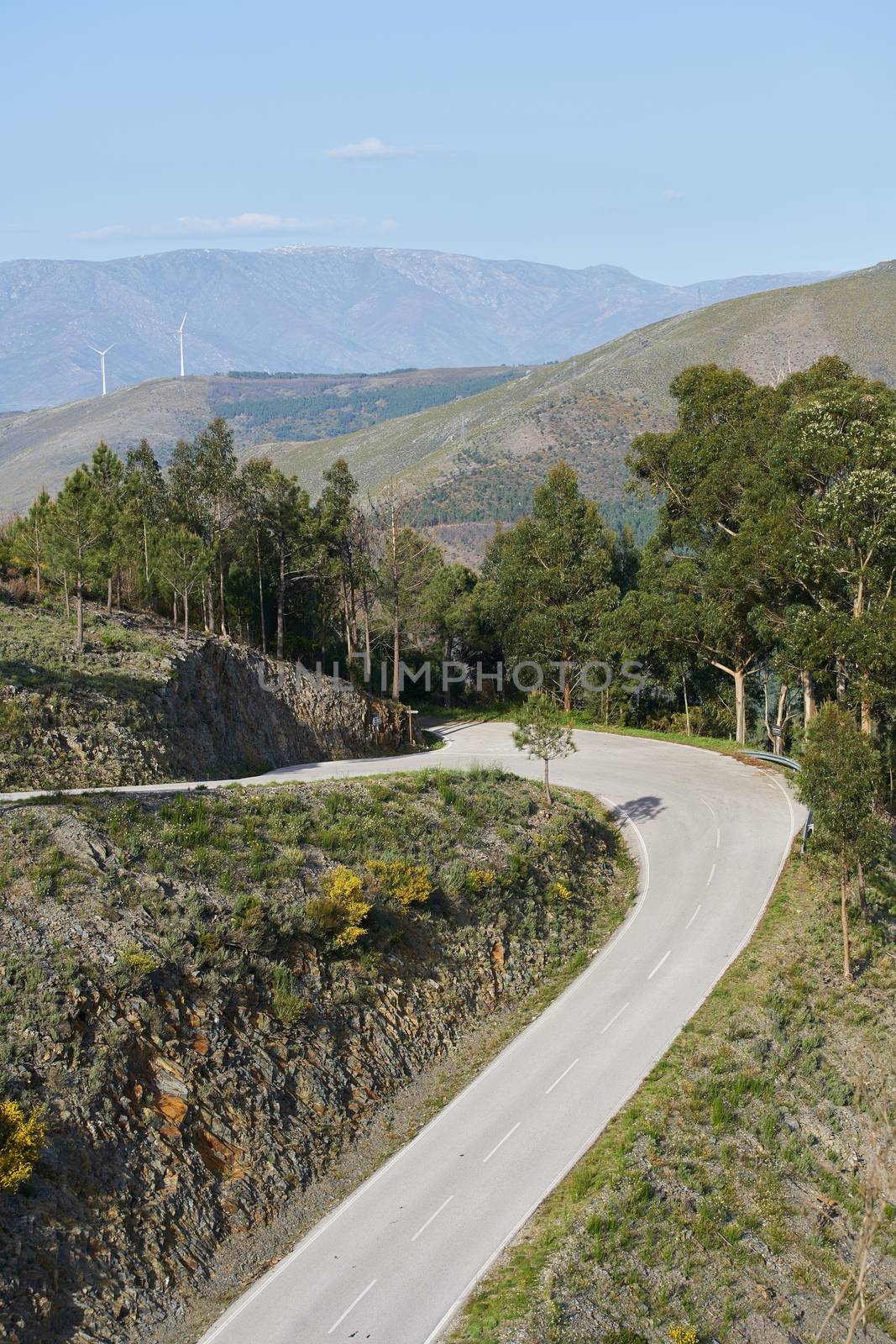 Beautiful road curve on a mountain landscape in Piodao, Portugal by Luispinaphotography