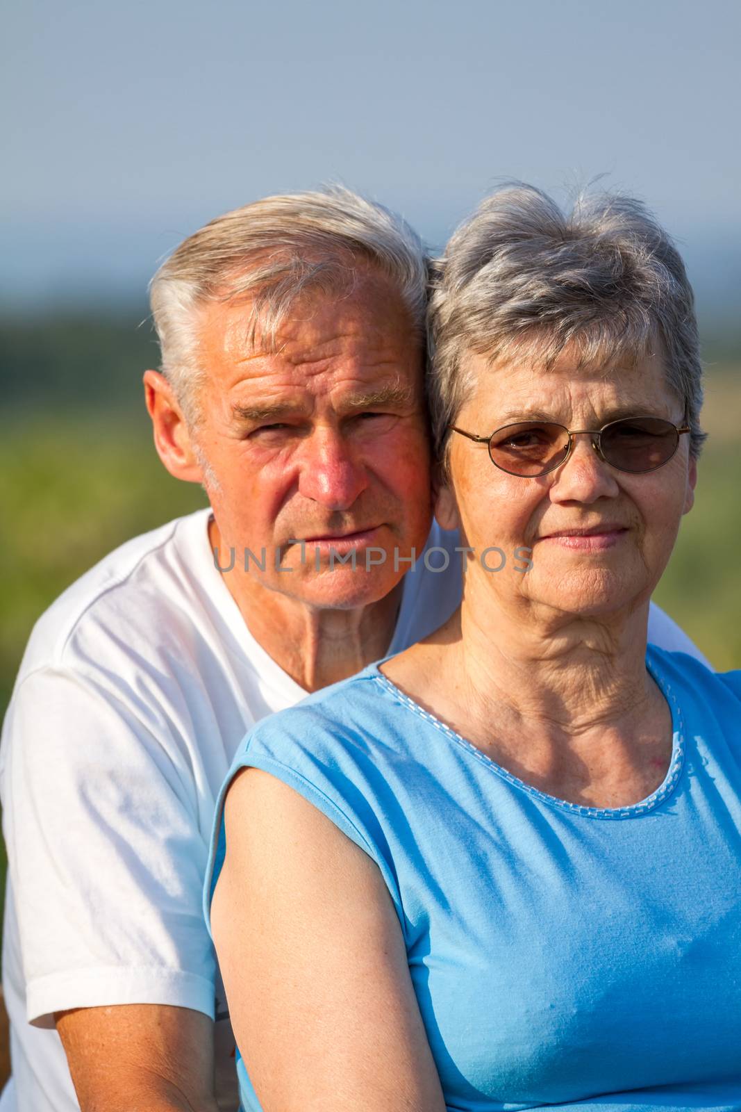 Happy elderly seniors couple in outdoors