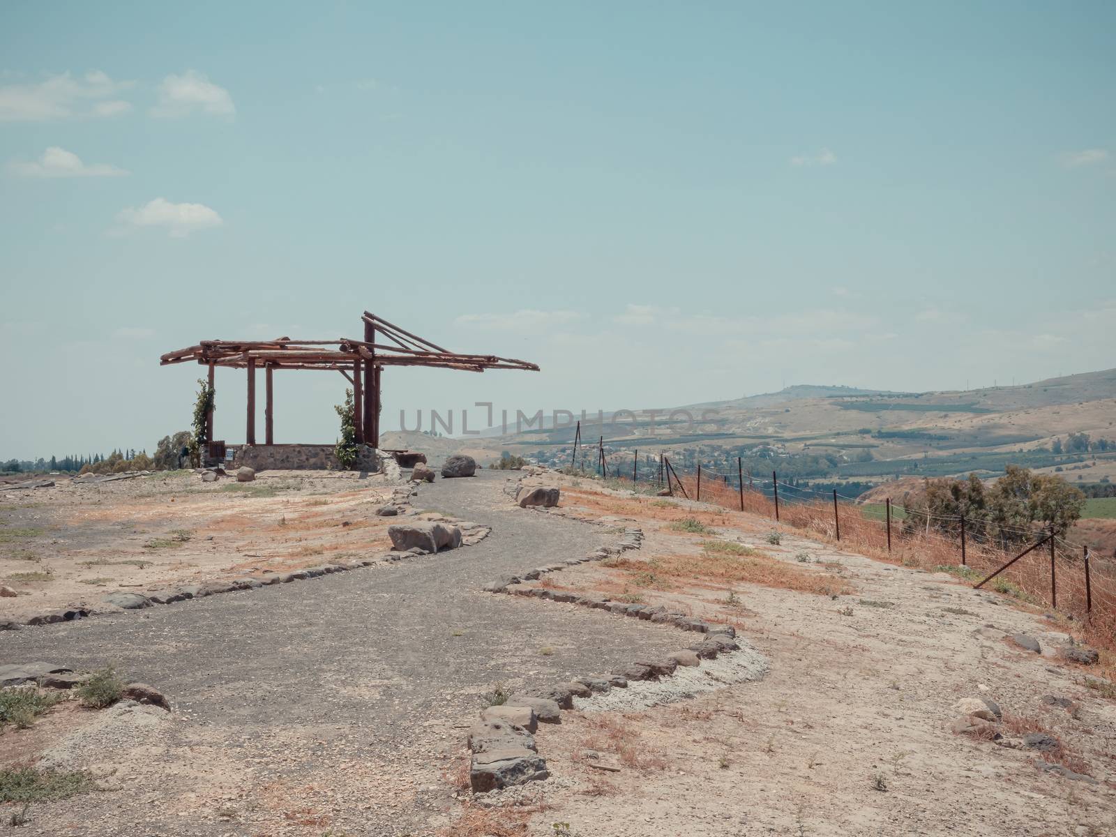Lookout with panoramic view of the landscape of the country area of Jordan Valley in northern Israel. A tourist destination of the rural and nature area with the Jordan River and agricultural fields.