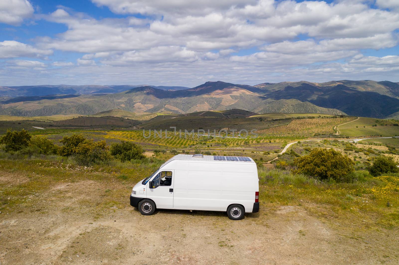 Landscape drone aerial view of a van social distancing vanlife in miradouro de Sao Gabriel viewpoint, Portugal by Luispinaphotography