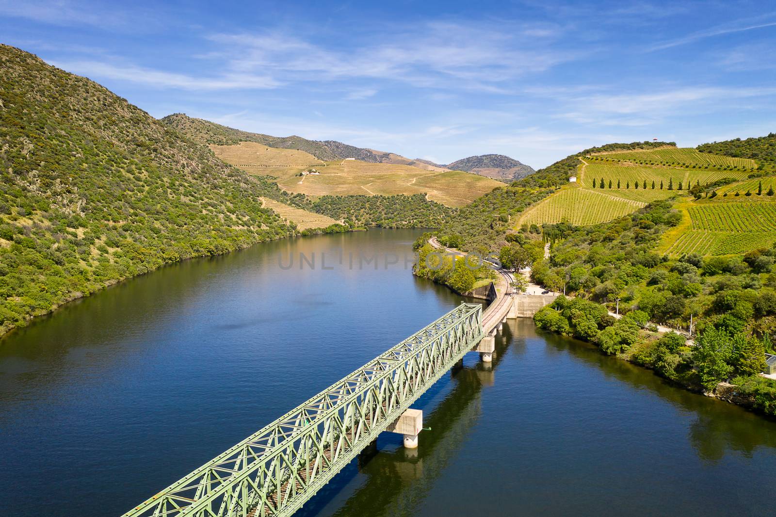 Douro railway bridge drone aerial view of river wine region in Ferradosa, Portugal