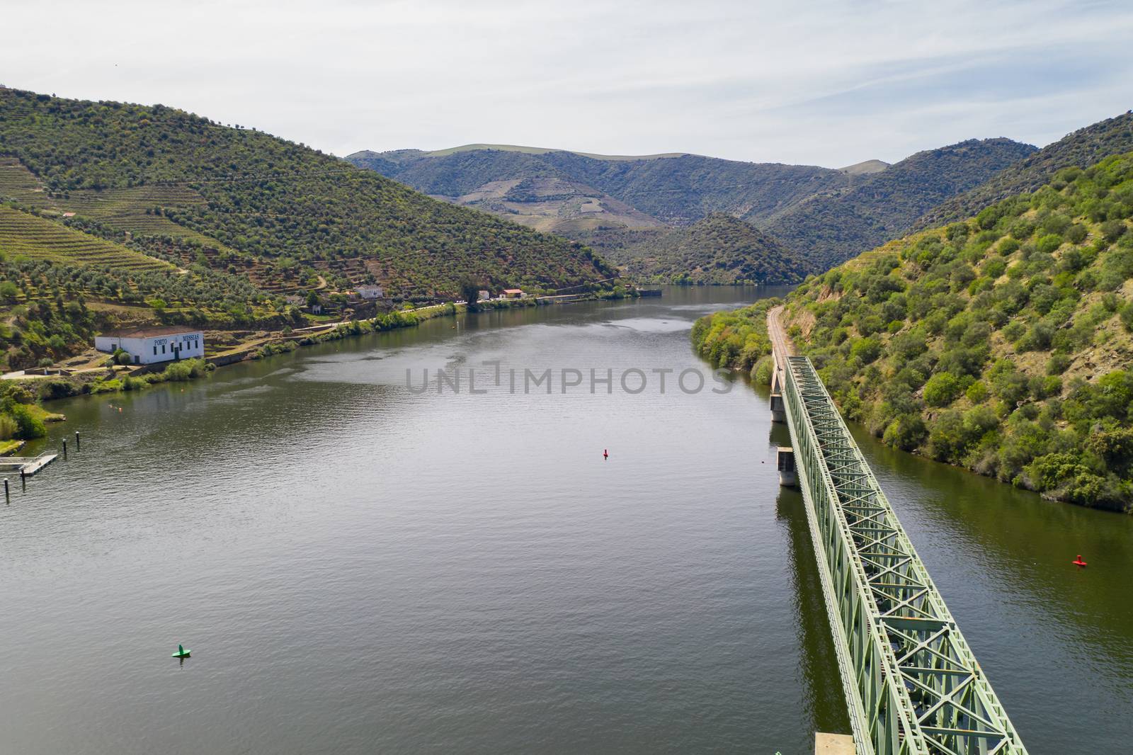 Douro railway bridge drone aerial view of river wine region in Ferradosa, Portugal