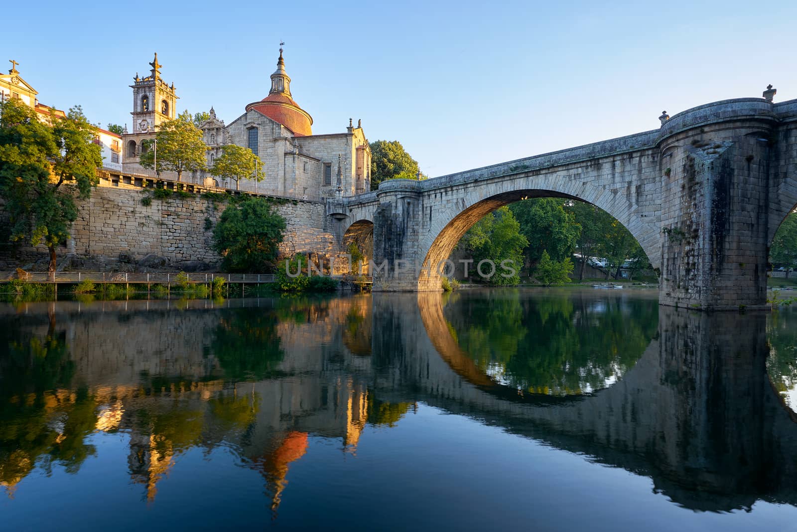 Amarante church view with Sao Goncalo bridge at sunset, in Portugal by Luispinaphotography