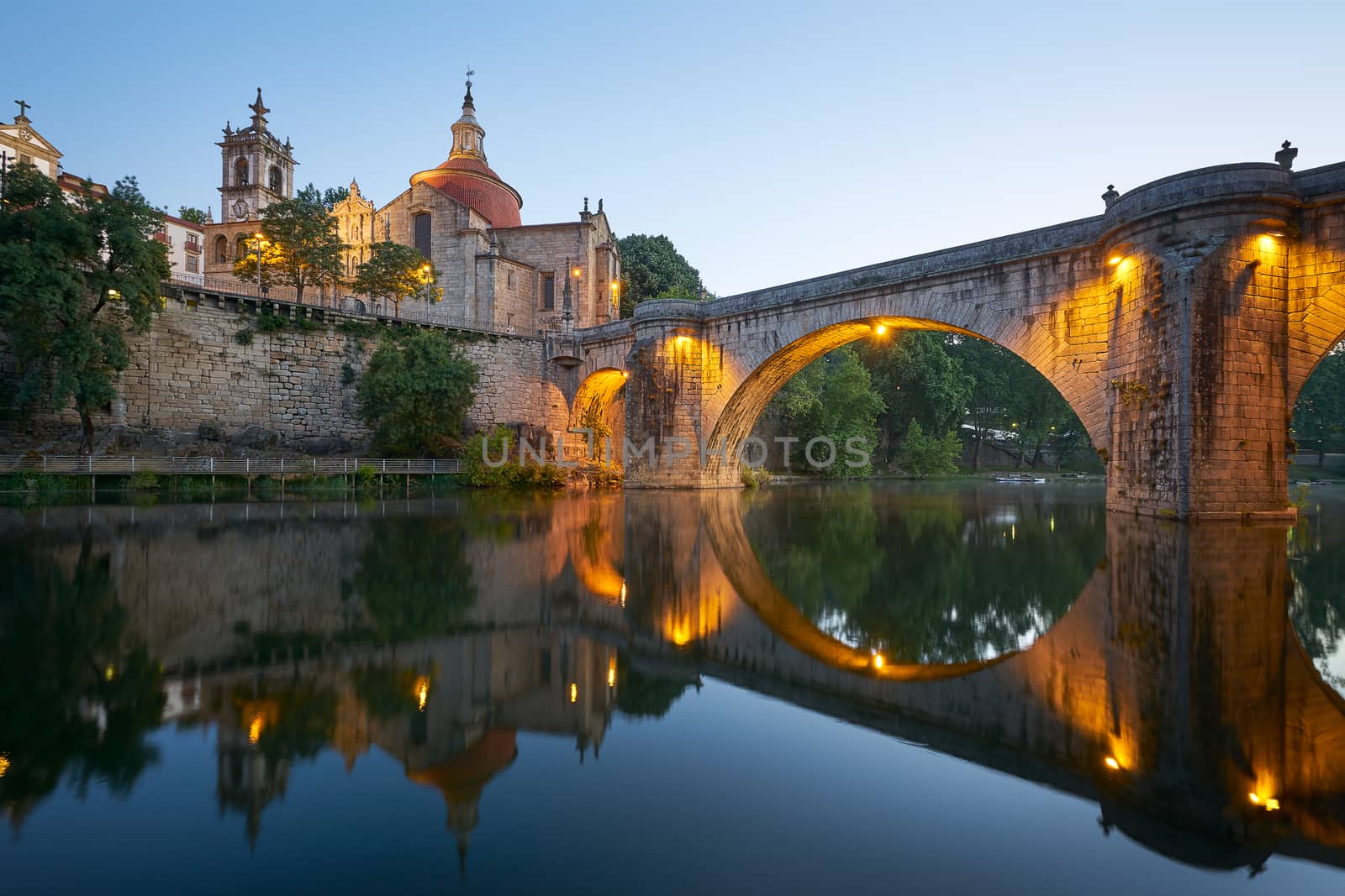 Amarante church view with Sao Goncalo bridge at sunset, in Portugal by Luispinaphotography