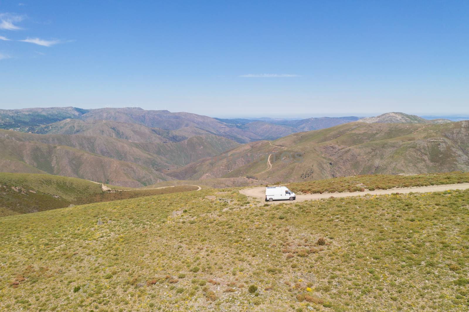 Serra da Freita drone aerial view of a camper van in Arouca Geopark on a road, in Portugal by Luispinaphotography