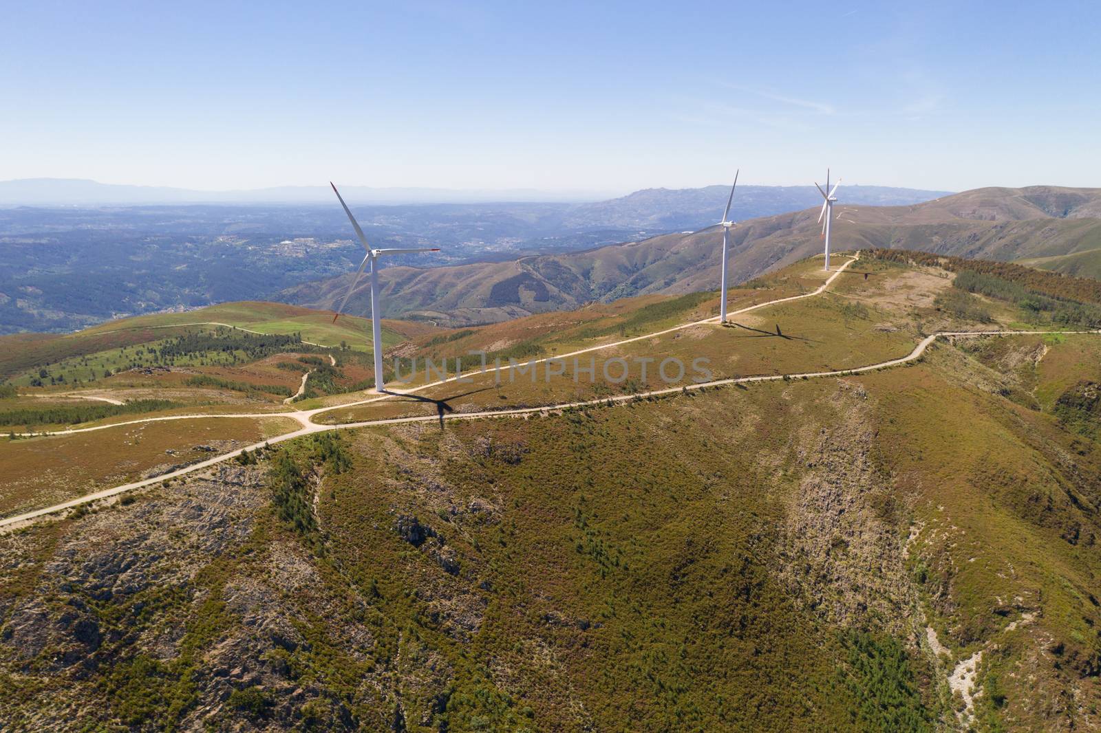 Wind turbines drone aerial view renewable energy on the middle of Serra da Freita Arouca Geopark, in Portugal by Luispinaphotography