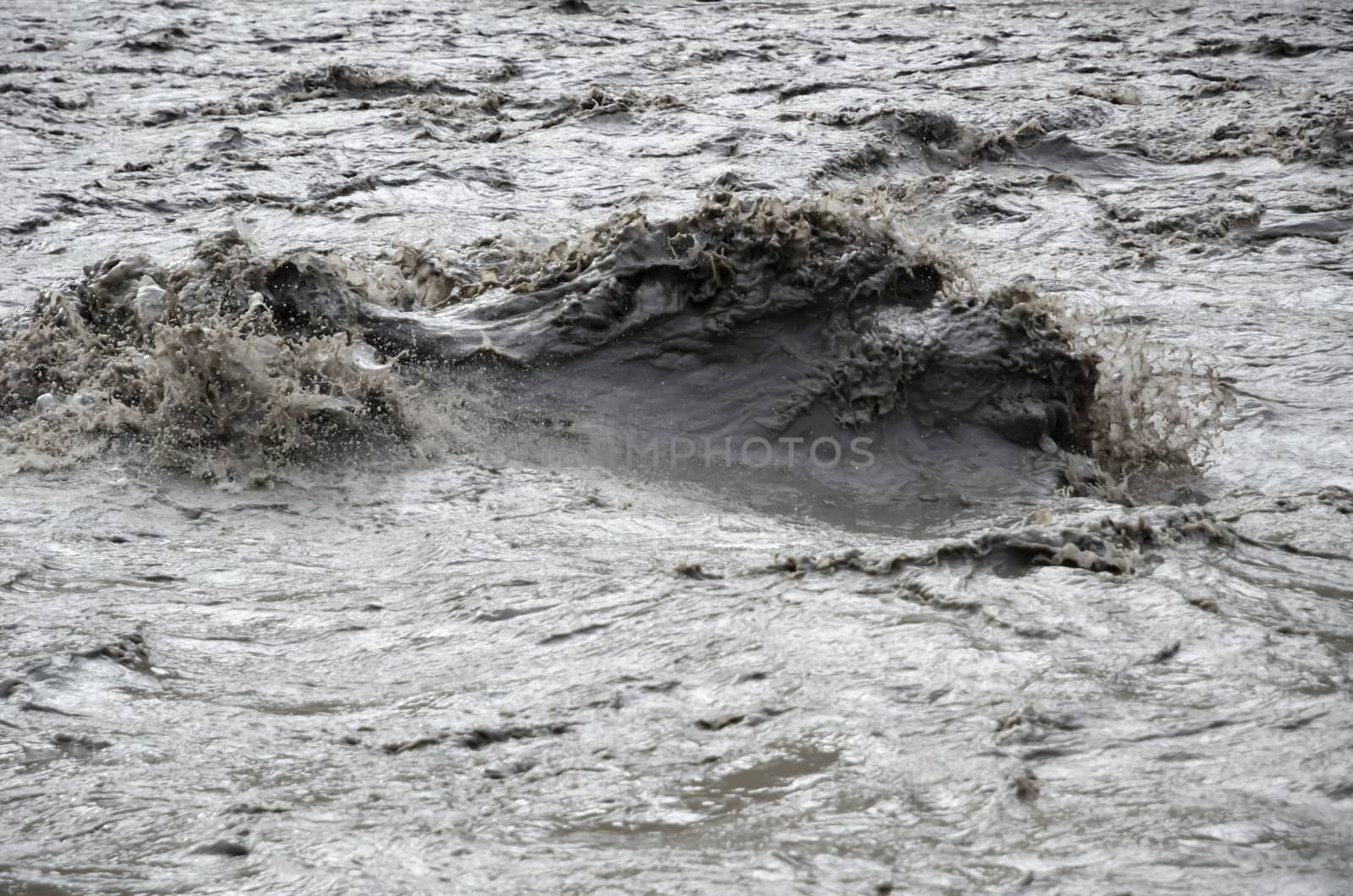 Fast, affluent and muddy mountain Nepal river near Jomsom village