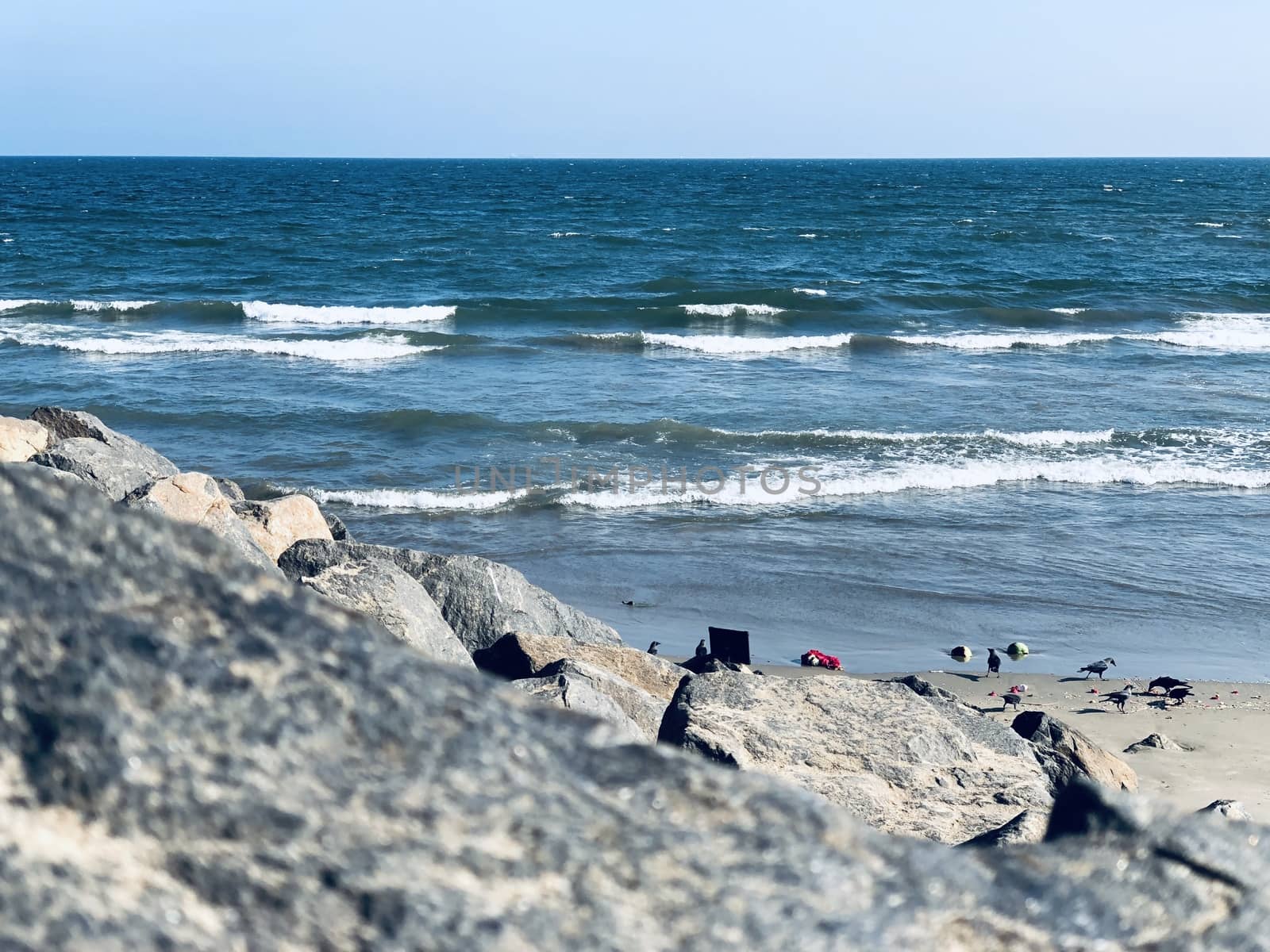 Sea waves on the beach with rocks on the shore at Ennore beach, Tamil nadu by prabhakaran851