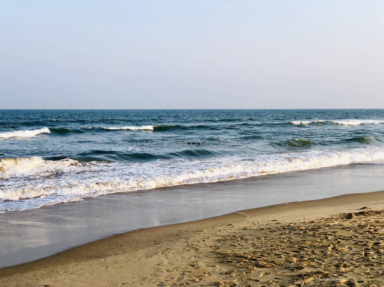 Beautiful view of seashore with sea waves during the summer season