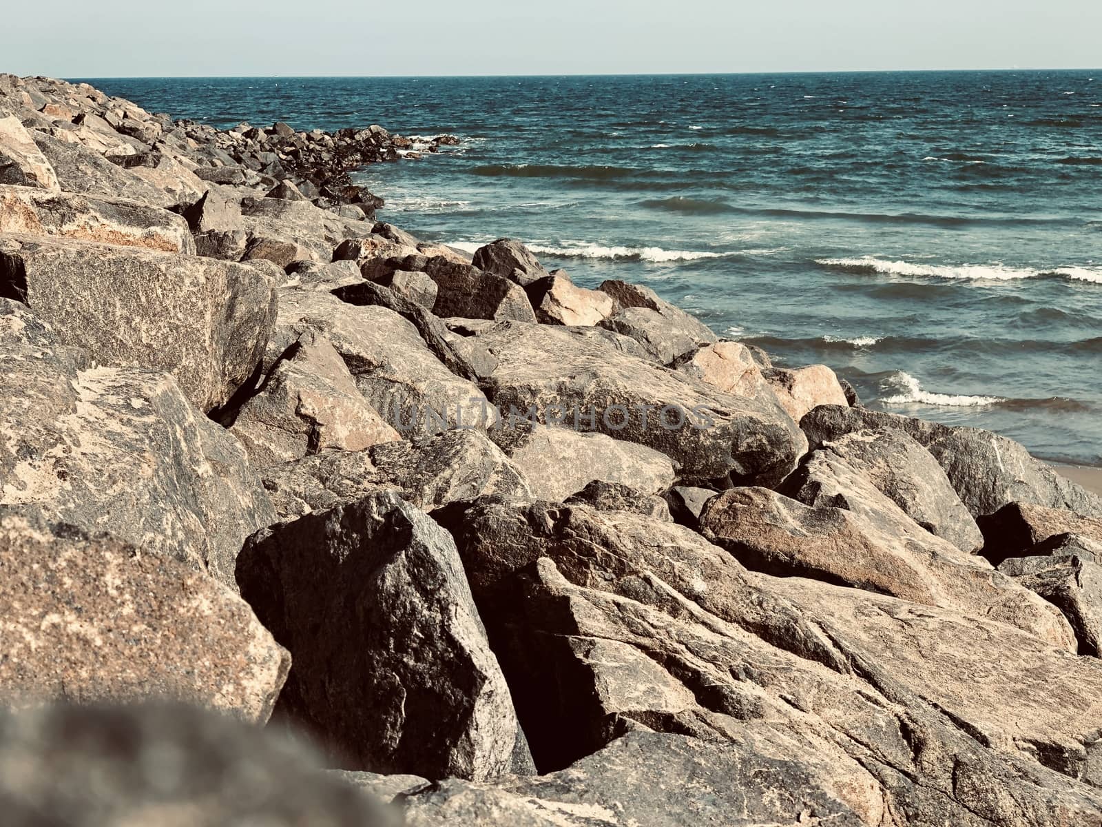 Sea waves on the beach with rocks on the shore at Ennore beach, Tamil nadu by prabhakaran851