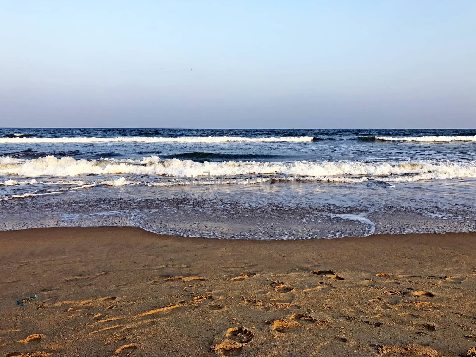 Beautiful view of seashore with sea waves during the summer season
