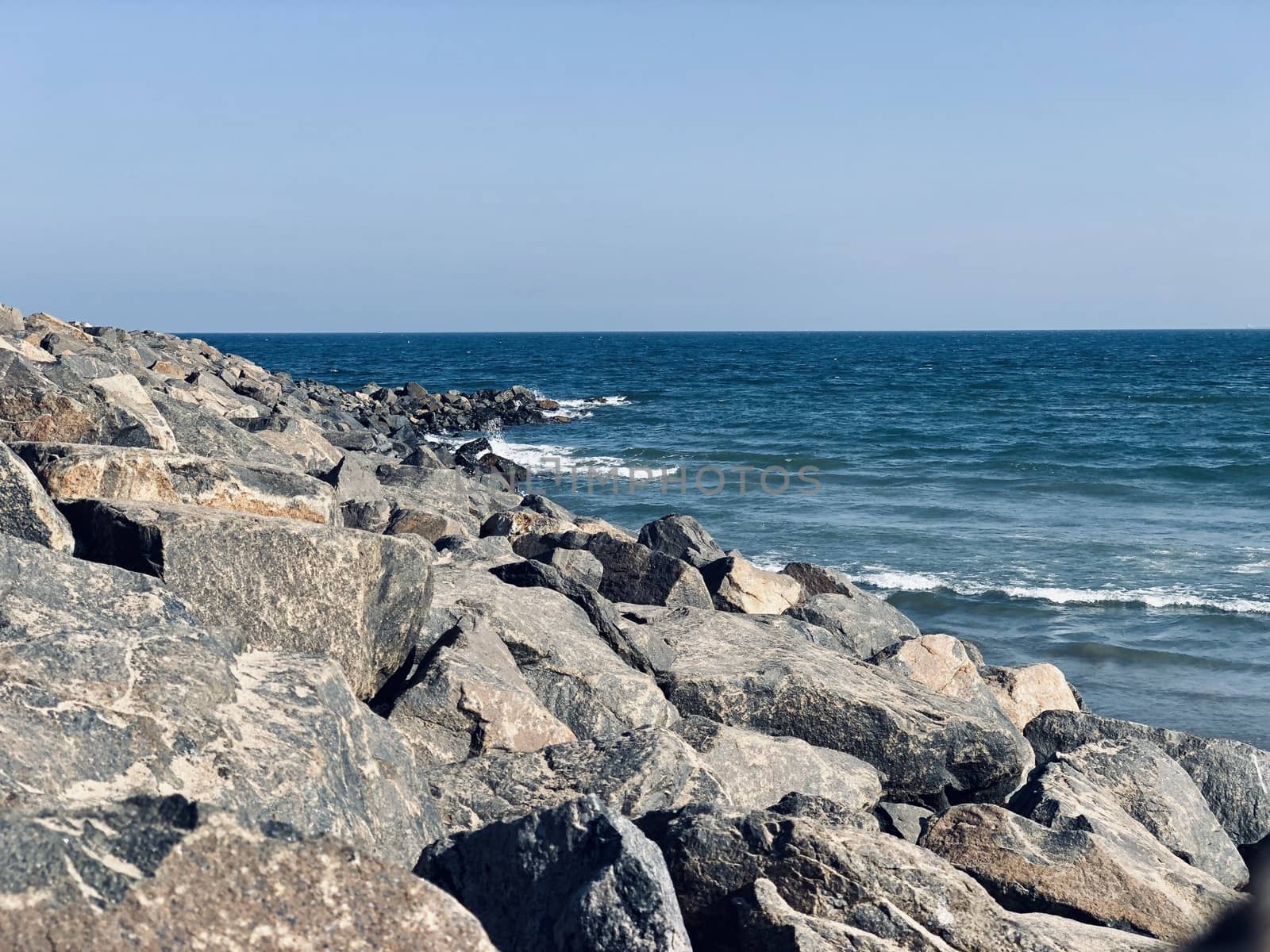 Sea waves on the beach with rocks on the shore at Ennore beach, Tamil nadu by prabhakaran851