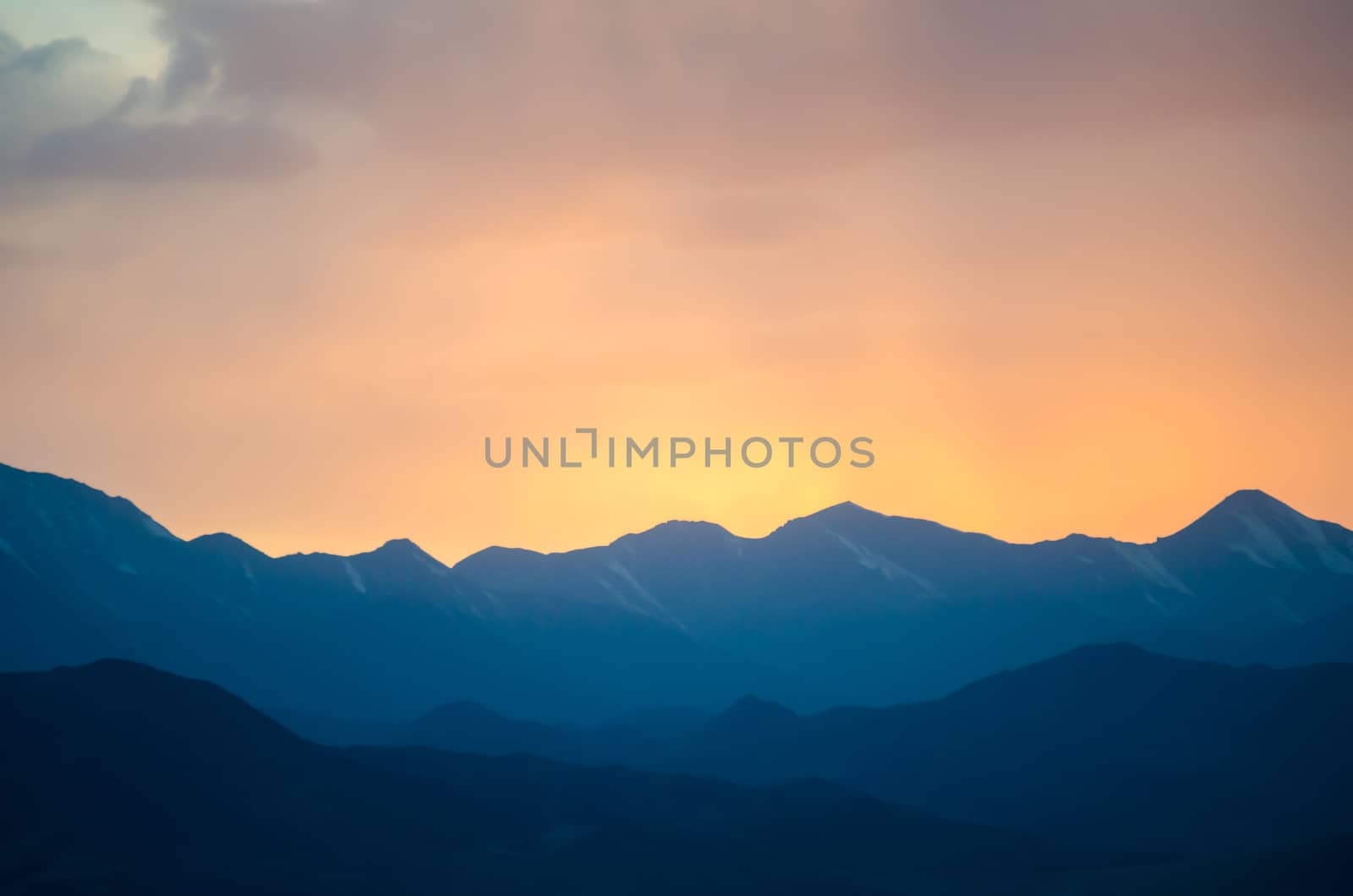 Colorful gradient sunset under the distant Tibetan mountains at Qinghai province