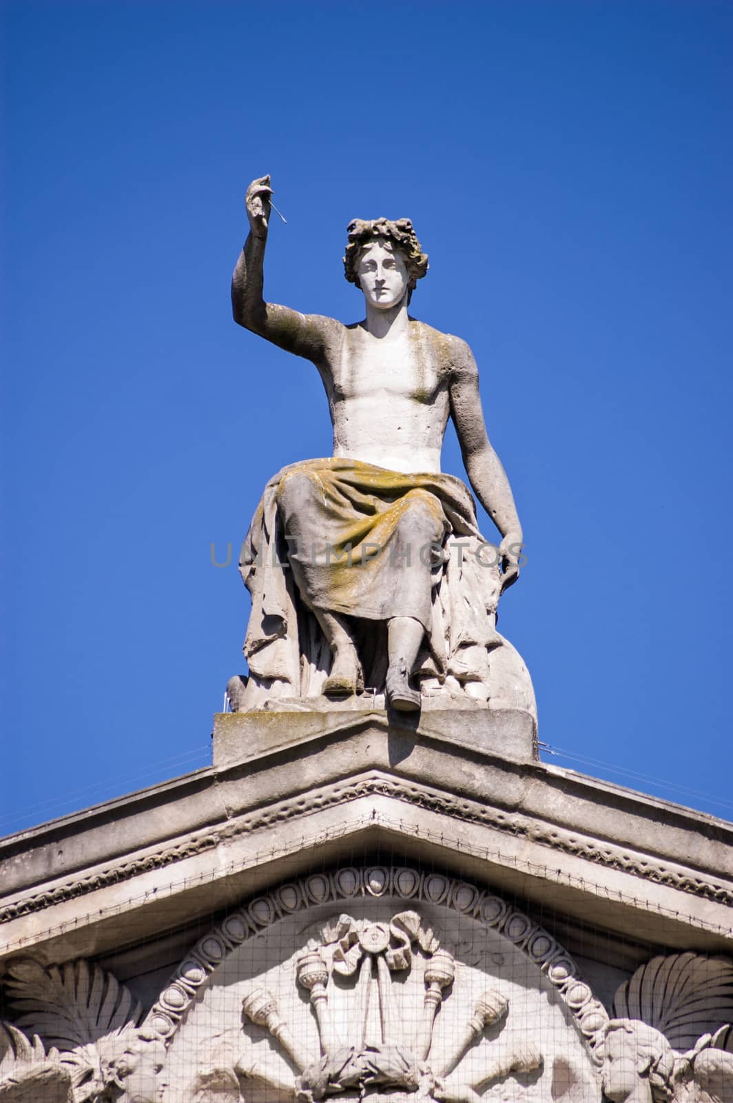 Statue of the Greek god Apollo on the pediment of Oxford's Ashmolean Museum.