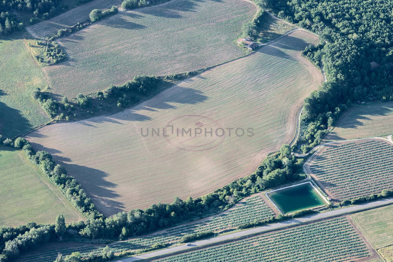 Humorous smiley emoticon on a harvested green field of Provence by nemo269