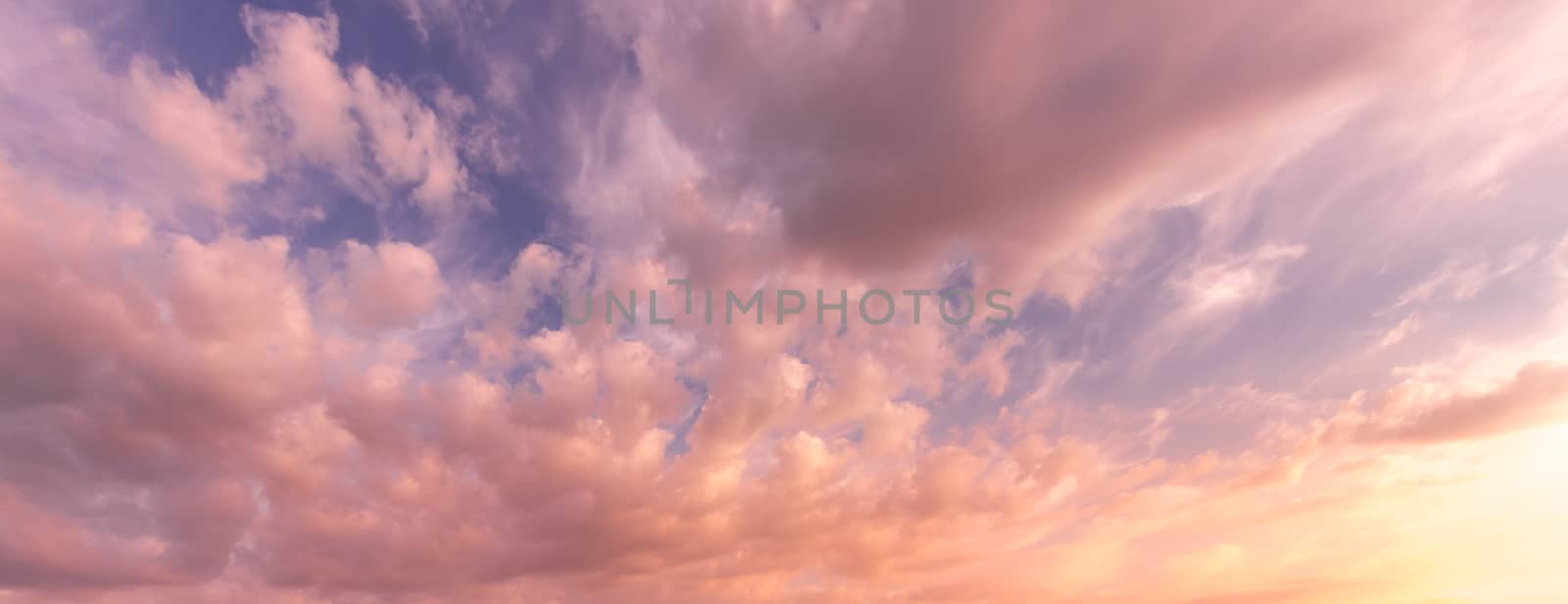 Cloudy sky at sunset or sunrise with sunlight. Abstract backdrop for design.